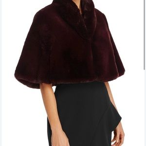 Designed in faux fur, this Betsey Johnson color is wine fits large/xl. New, NWT.